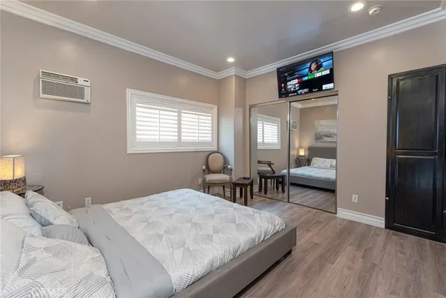 a bed sitting in a bedroom next to a window