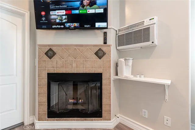 a room with a bed and a painting on the wall