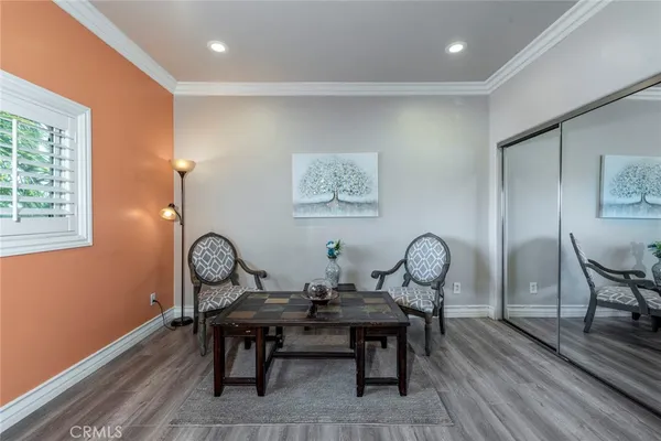 a room with furniture and a flat screen tv