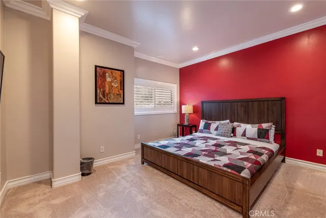 a bedroom with a bed and a couch