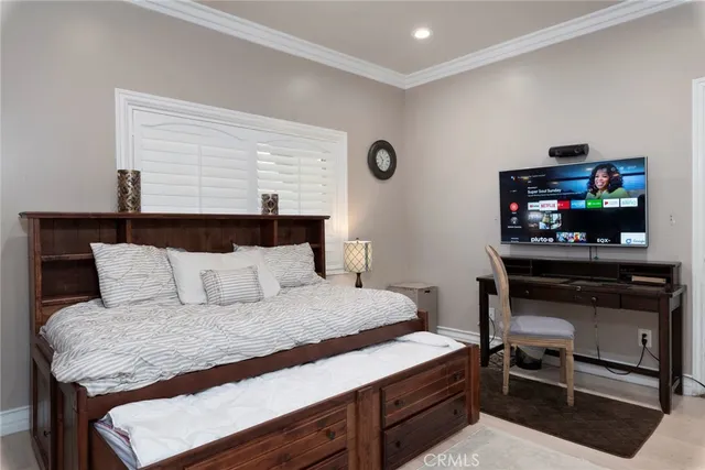 a bed room with a bed and a window