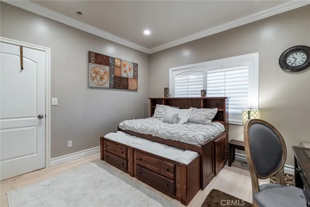a bathroom with a granite countertop sink a toilet a mirror and shower