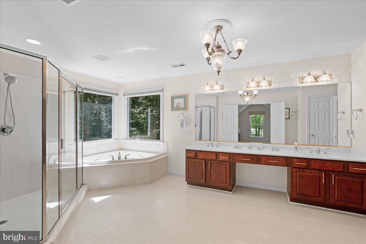 5 Beaver Ridge Road Stafford, VA 22556 - Photo 36 of 73 Soaking Tub windows overlook the wooded backyard