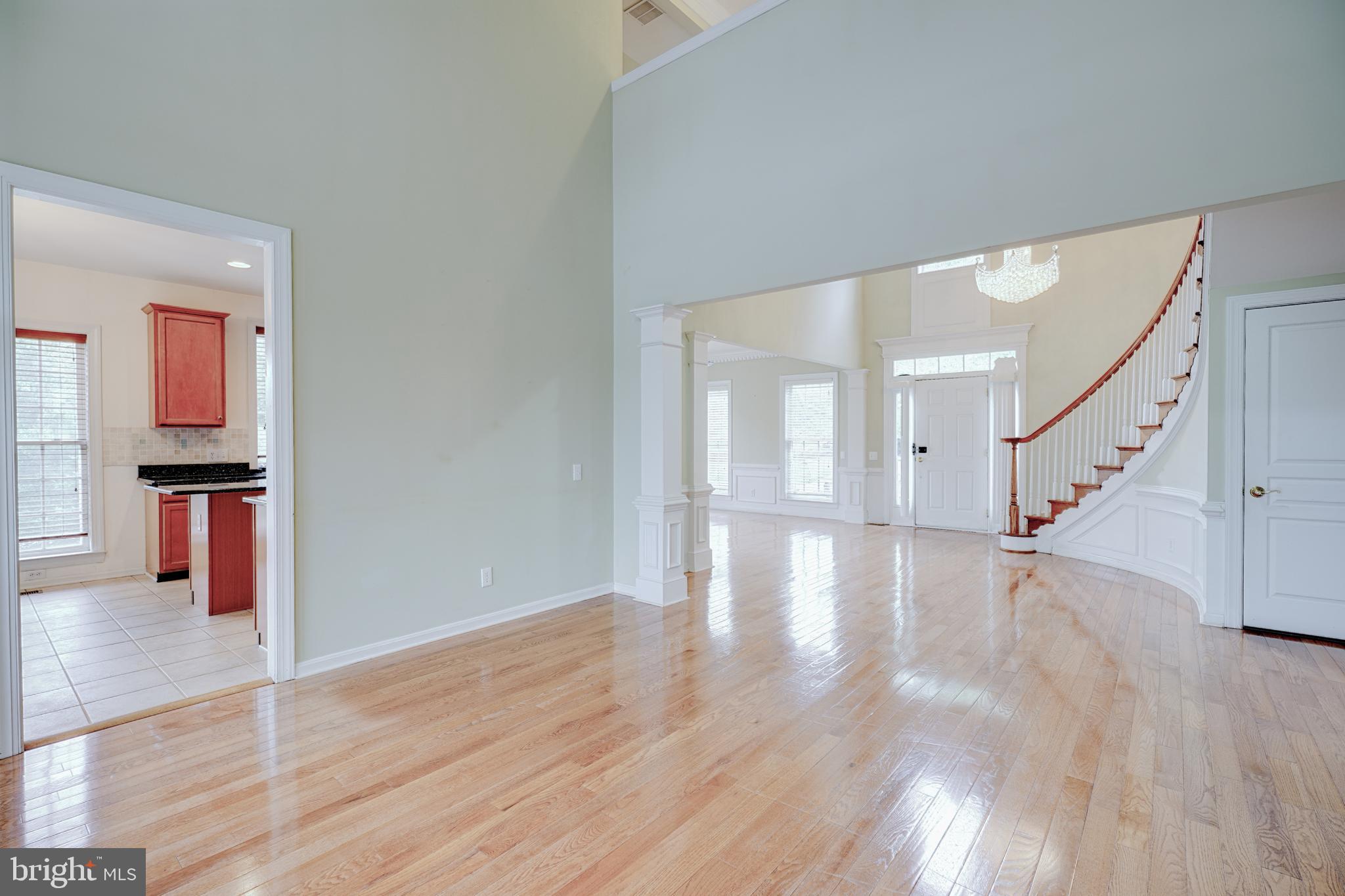 15 Ridings Way West Chester, PA 19382 - Photo 12 of 41 a view of an empty room with wooden floor and stairs