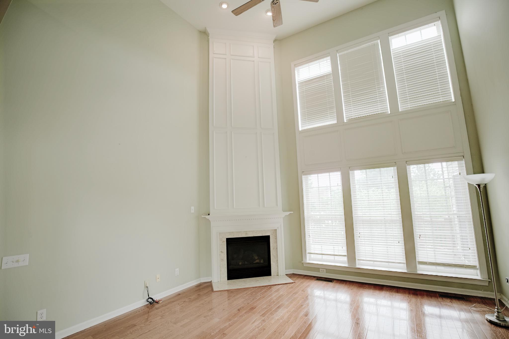 15 Ridings Way West Chester, PA 19382 - Photo 13 of 41 a view of empty room with wooden floor and fireplace