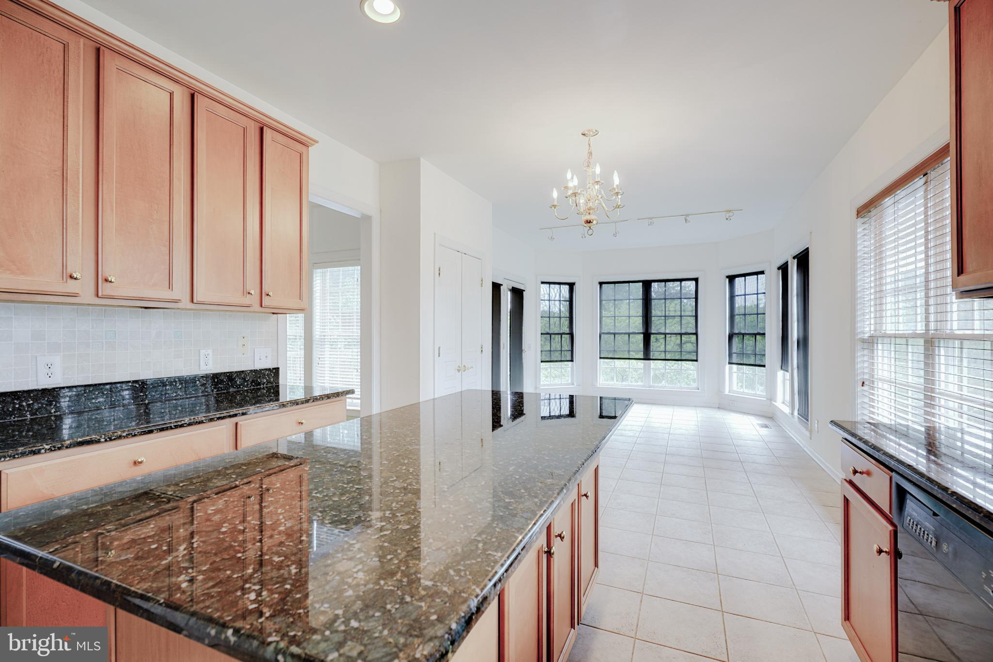 15 Ridings Way West Chester, PA 19382 - Photo 17 of 41 a large kitchen with kitchen island granite countertop a large window