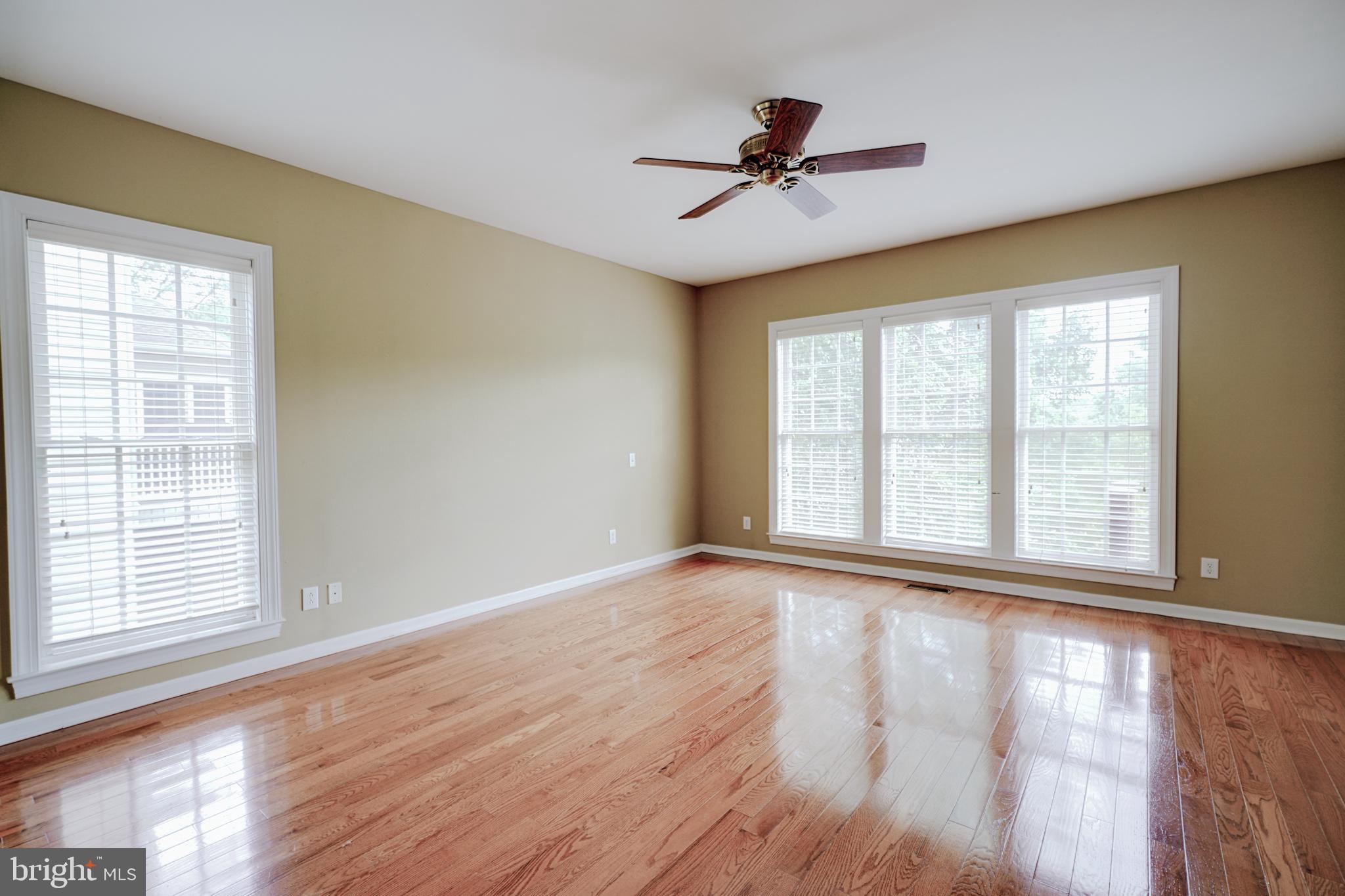 15 Ridings Way West Chester, PA 19382 - Photo 20 of 41 a view of empty room with wooden floor and fan