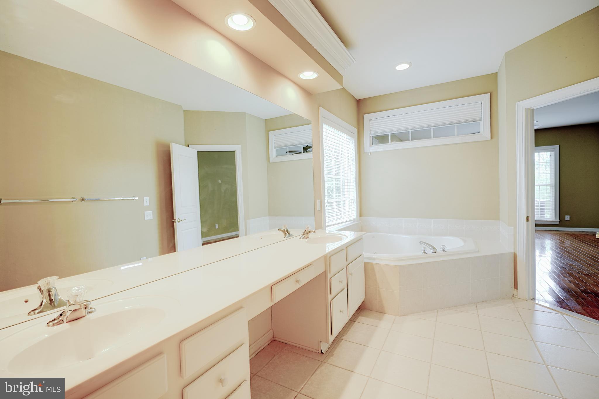 15 Ridings Way West Chester, PA 19382 - Photo 23 of 41 a spacious bathroom with a tub sink and mirror