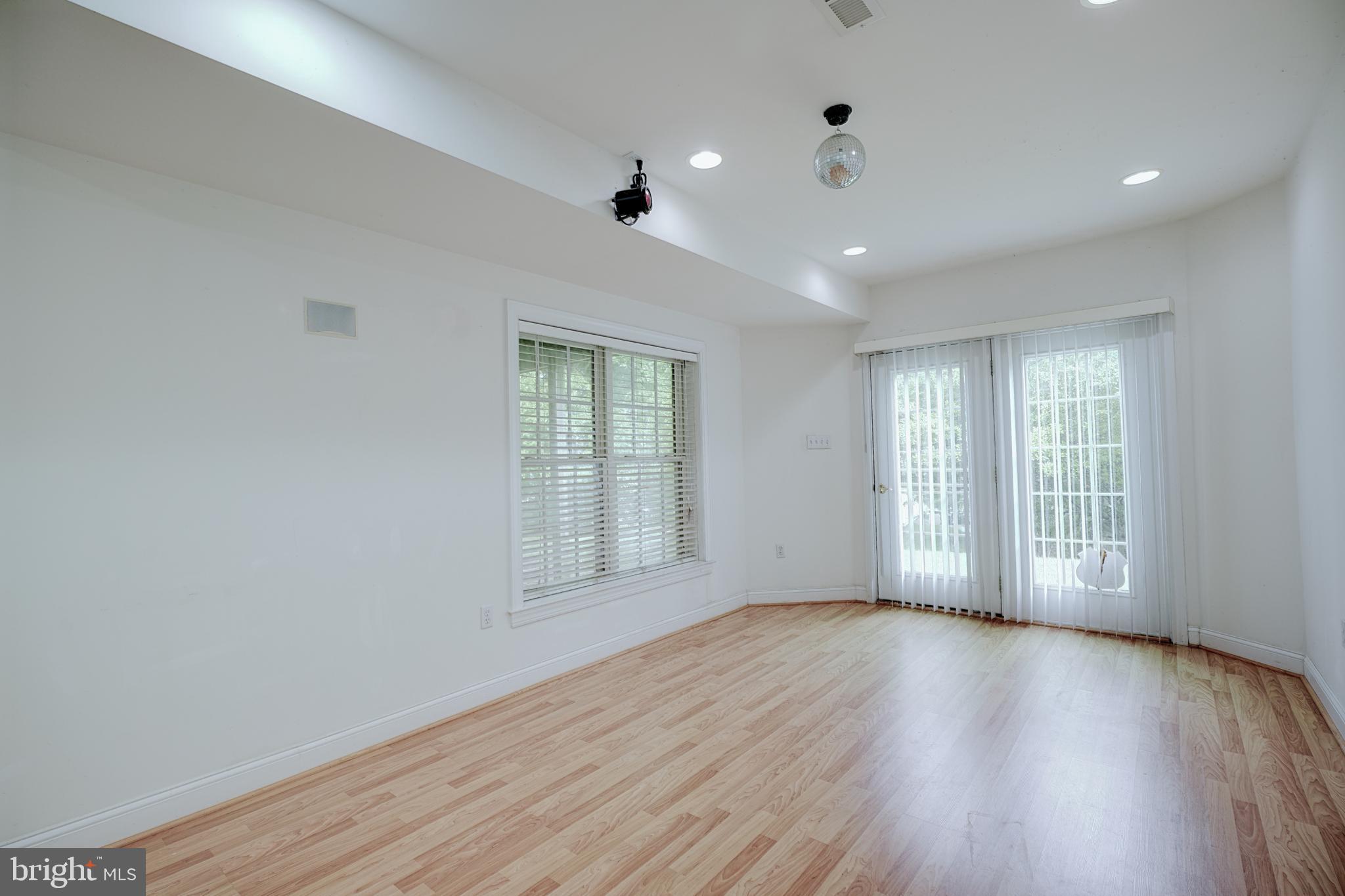 15 Ridings Way West Chester, PA 19382 - Photo 39 of 41 a view of an empty room with a window and wooden floor