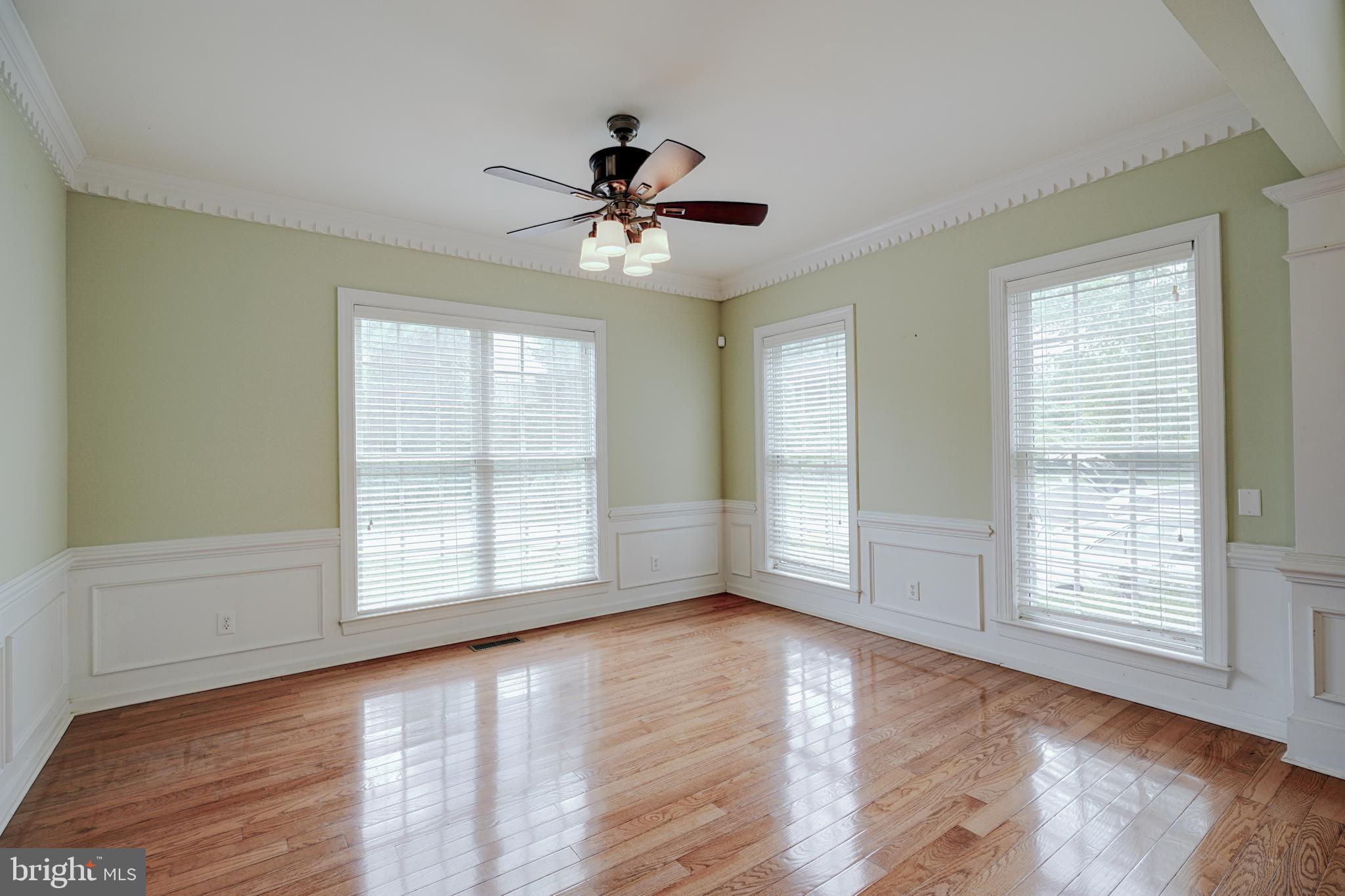 15 Ridings Way West Chester, PA 19382 - Photo 10 of 41 a view of an empty room with wooden floor and a window