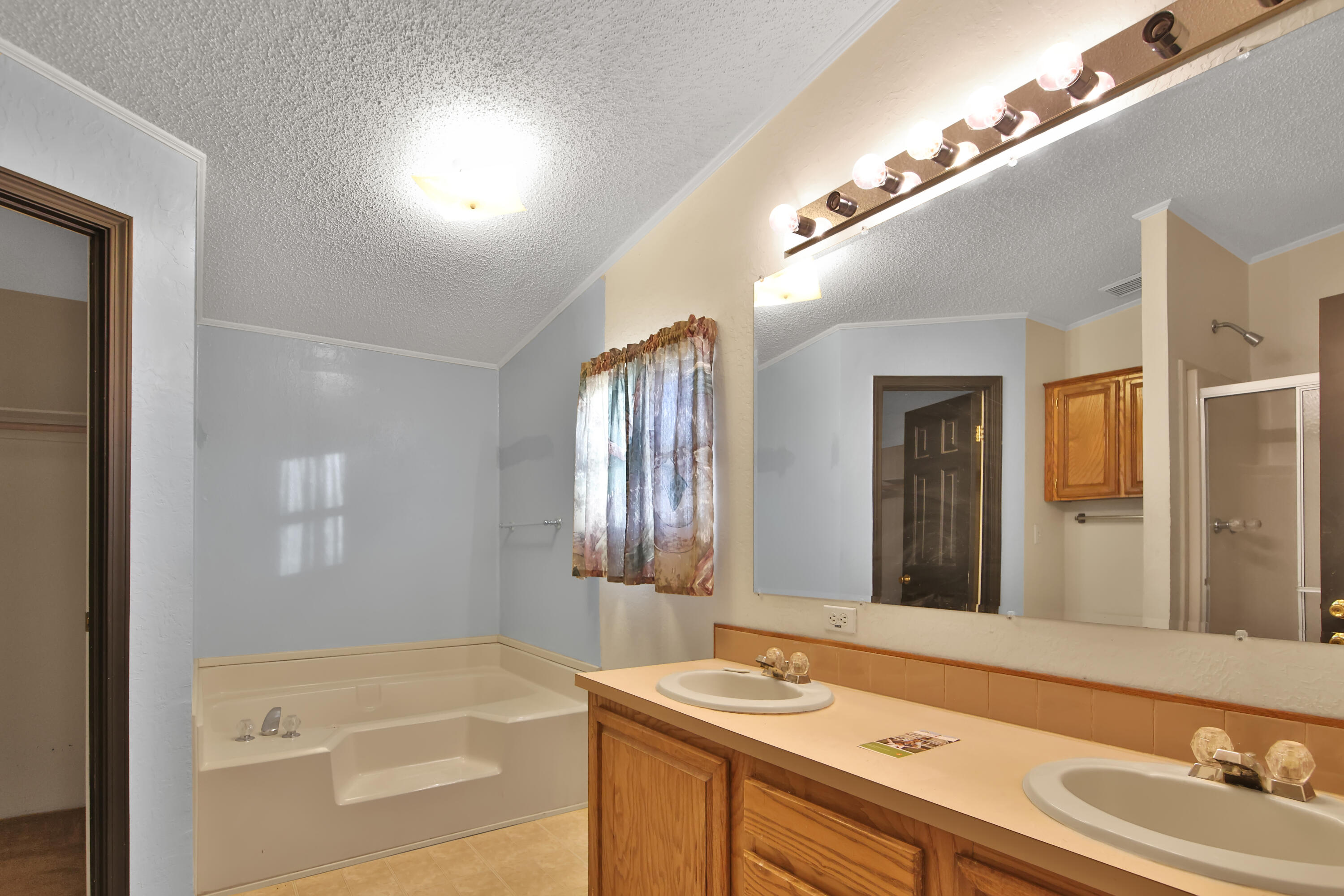 120 Highway 114 Estates Road Lubbock, TX 79407 - Photo 21 of 49 a bathroom with a sink and a mirror
