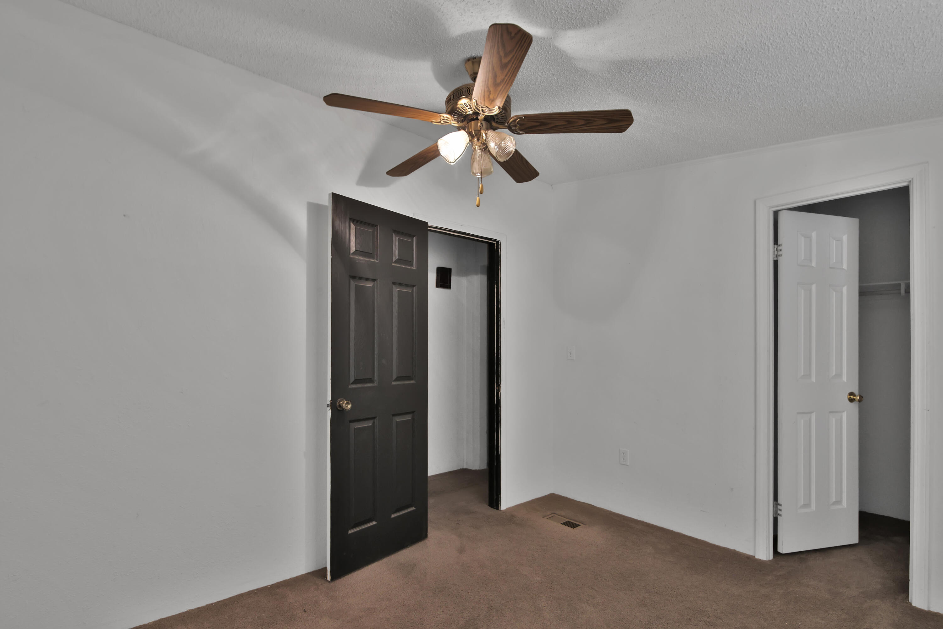 120 Highway 114 Estates Road Lubbock, TX 79407 - Photo 31 of 49 an empty room with closet and a chandelier fan