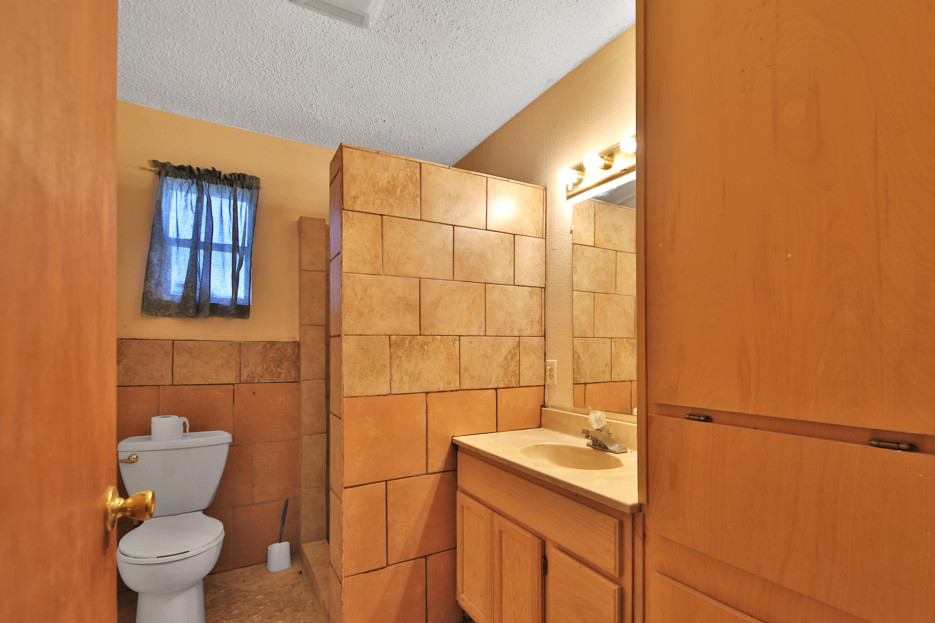 120 Highway 114 Estates Road Lubbock, TX 79407 - Photo 37 of 49 a bathroom with a sink toilet and shower