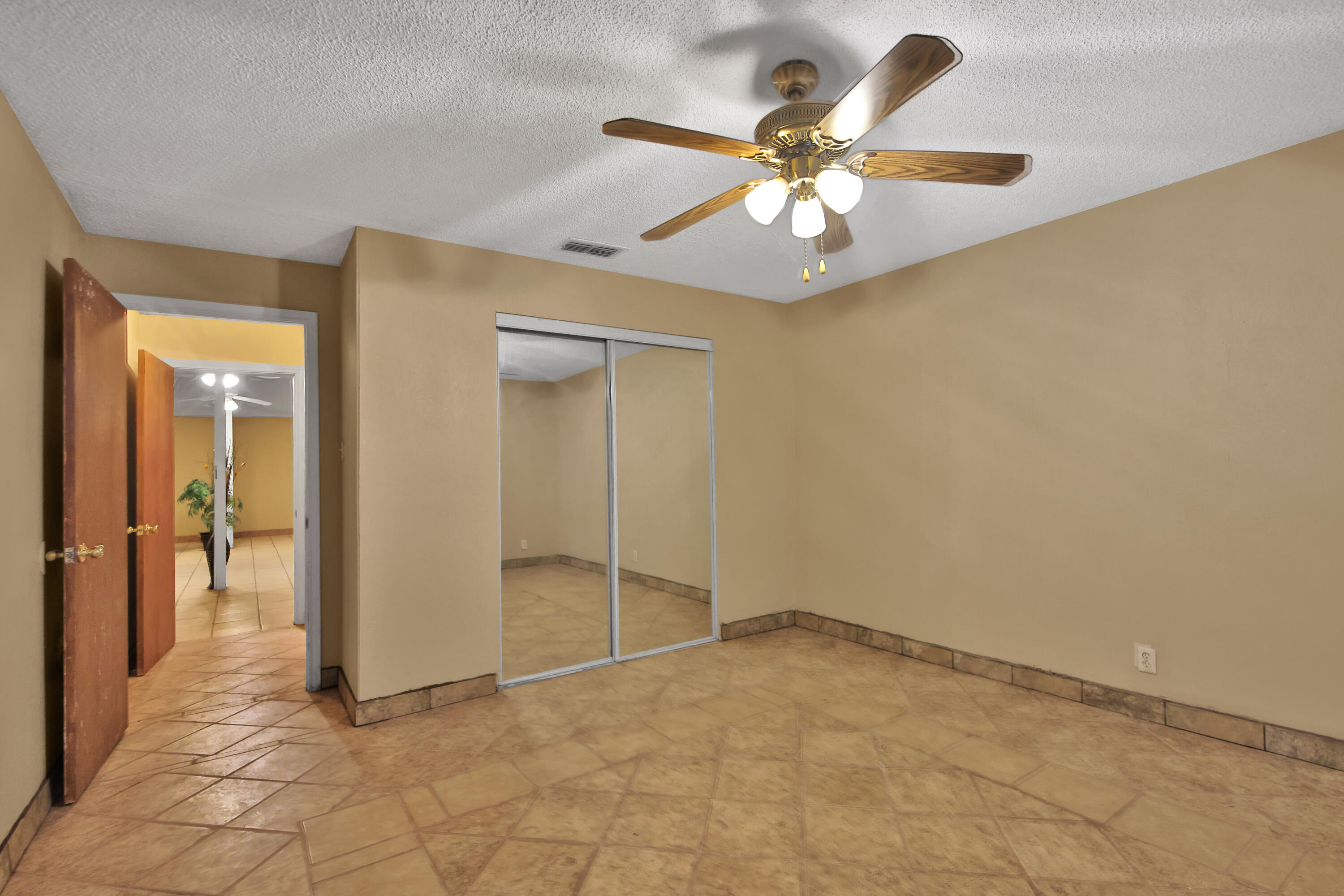 120 Highway 114 Estates Road Lubbock, TX 79407 - Photo 40 of 49 an empty room and chandelier fan