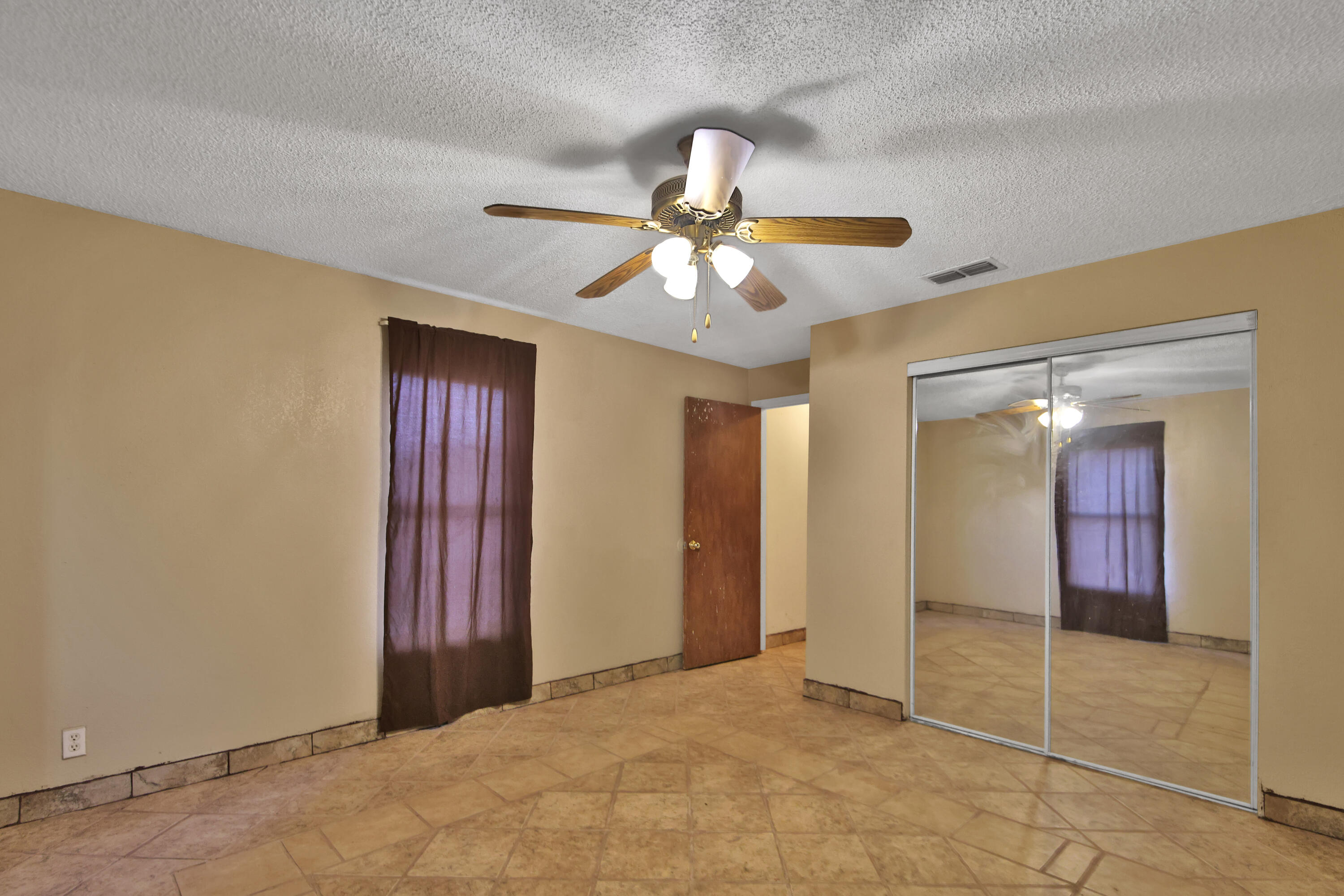 120 Highway 114 Estates Road Lubbock, TX 79407 - Photo 41 of 49 a view of a livingroom with a chandelier fan and a bathroom