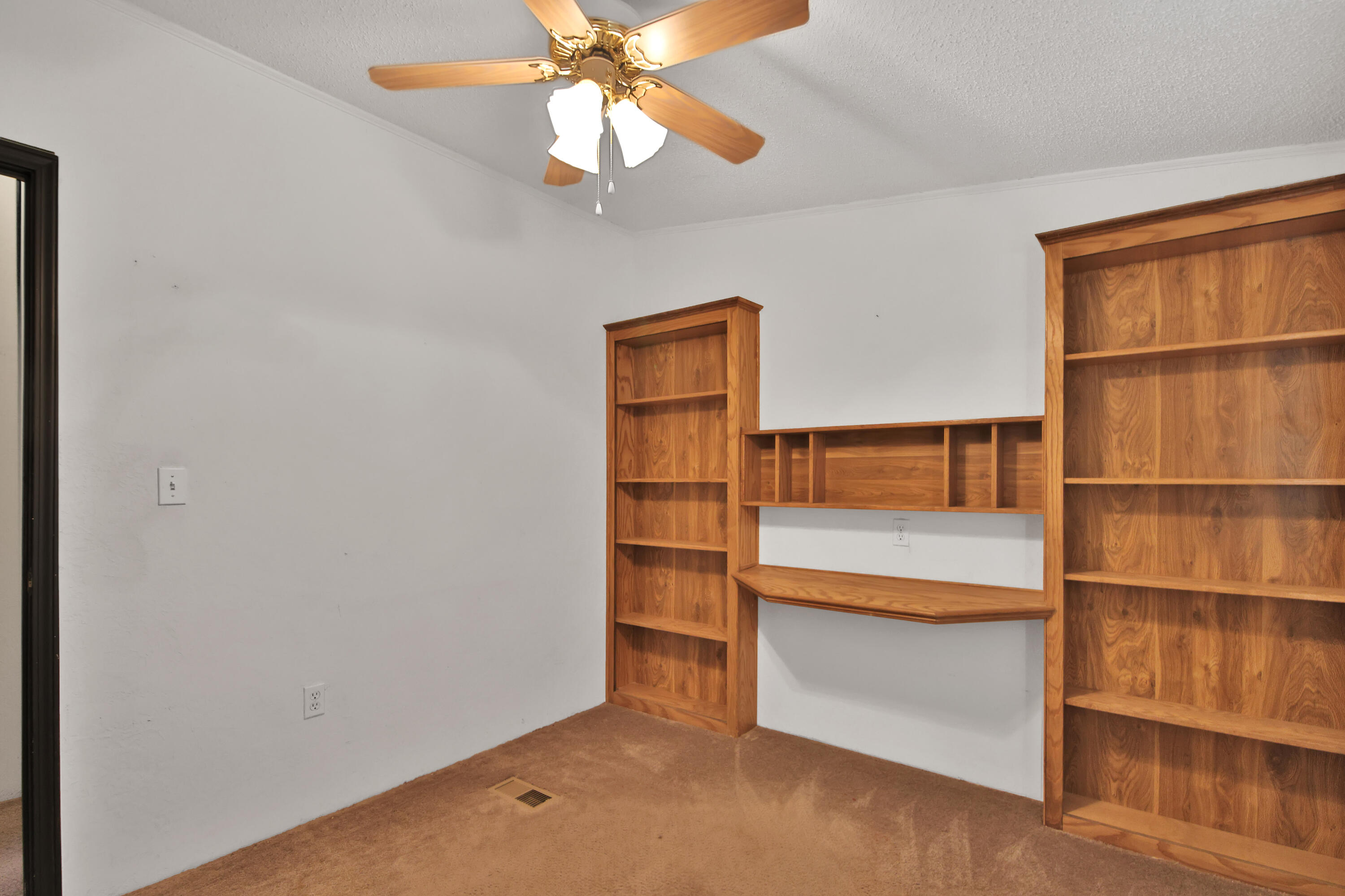 120 Highway 114 Estates Road Lubbock, TX 79407 - Photo 8 of 49 a view of an empty room with a cabinet and a window
