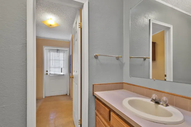 a bathroom with a sink and a mirror