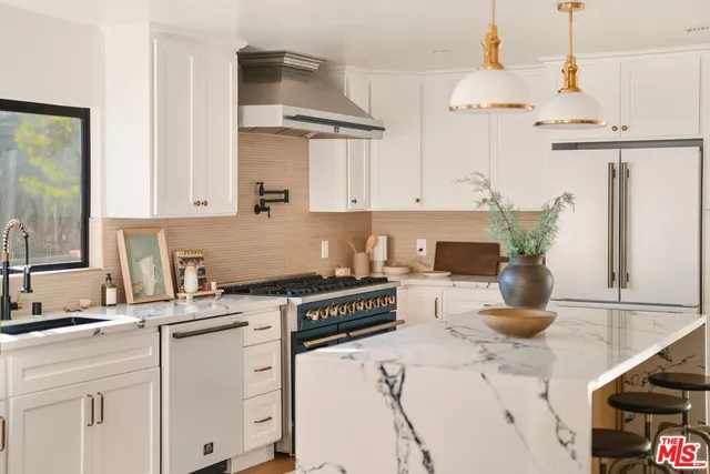 a close view of a stove sitting inside of a kitchen
