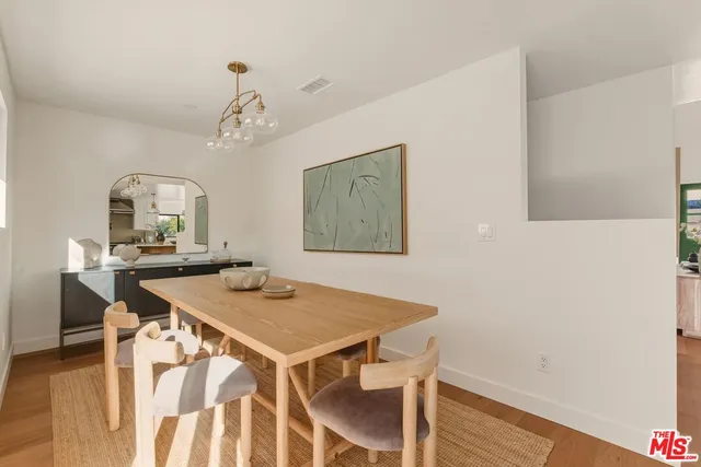 a bathroom with a sink mirror and toilet