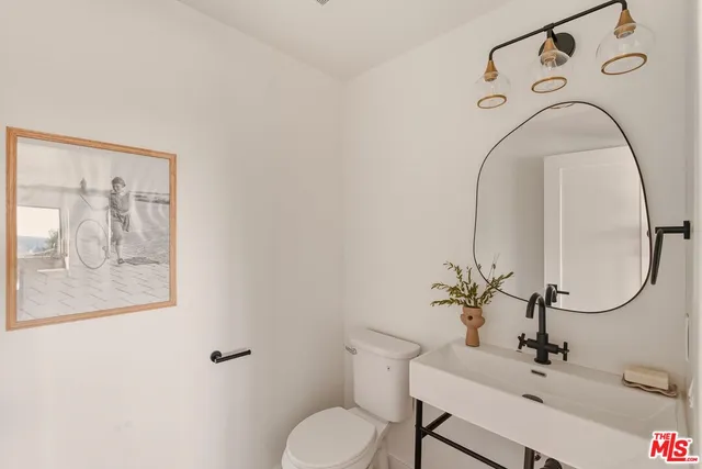 a living room with furniture and a lamp