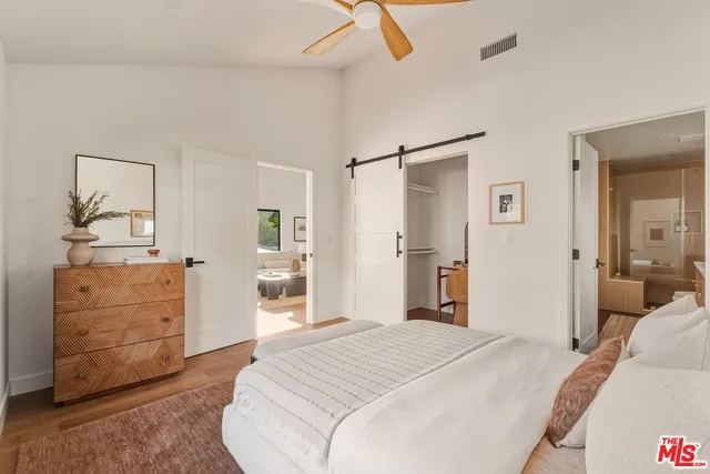 a view of living room with furniture and potted plant