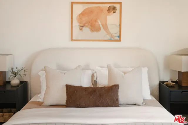 a bathroom with a granite countertop sink mirror toilet and shower