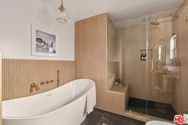 a bedroom with a bed and a table in it