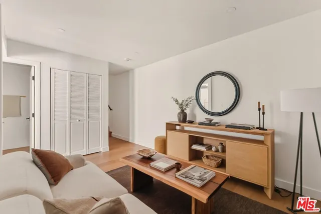 a view of balcony with wooden floor and seating space
