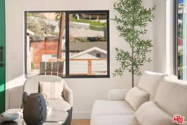 a kitchen with stainless steel appliances granite countertop a sink a stove and a cabinets