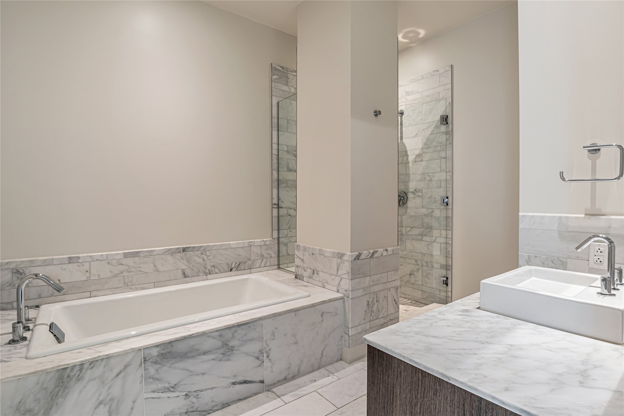 210 Lavaca Street, Unit 2903 Austin, TX 78701 - Photo 18 of 39 Guest Bathroom #1: Full bathroom with a shower stall, a bath, vanity, and tile walls