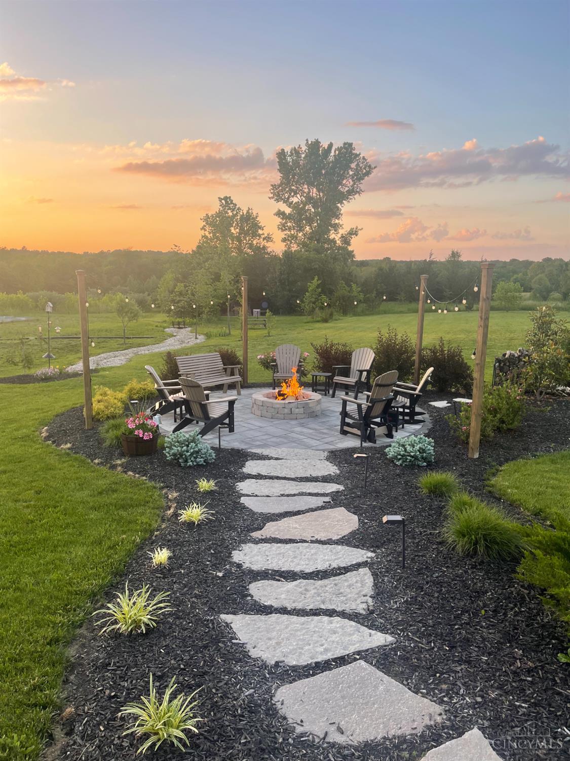 2220 Wilmington Road Lebanon, OH 45036 - Photo 11 of 91 Follow the large rock steppingstones leading to a beautifully designed fire pit area. Imagine the memories you can make with family and friends sitting around the firepit!