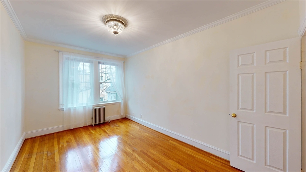 311 Tappan Street, Unit 3 Brookline, MA 02445 - Photo 32 of 35 a view of room with hardwood floor and window