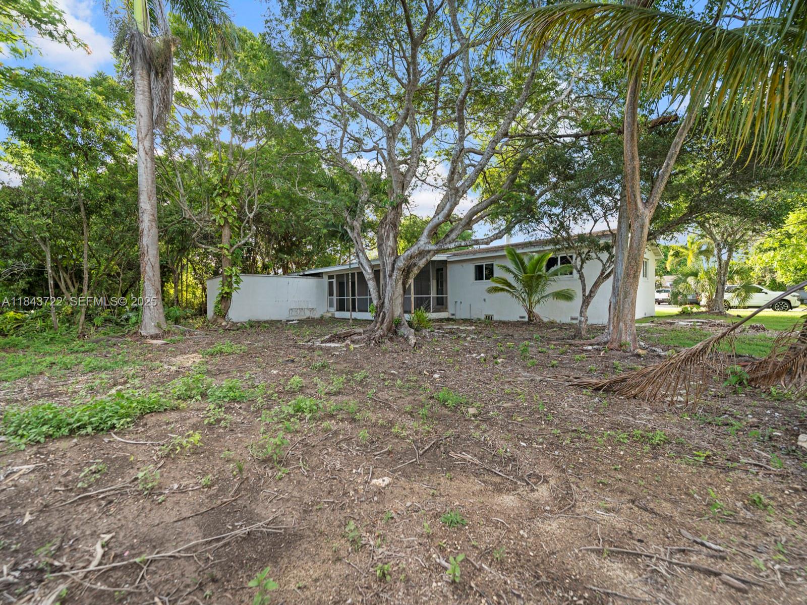 17300 Southwest 300th Street Homestead, FL 33030 - Photo 26 of 33 a view of a house with large trees