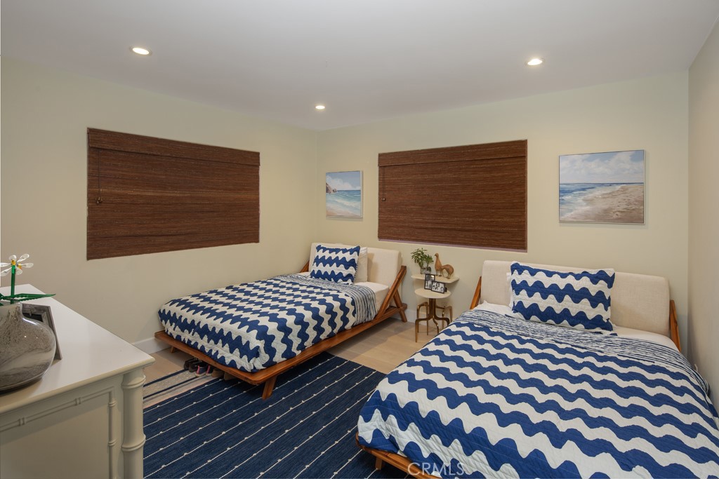 309 Marguerite Avenue, Unit C Corona del Mar, CA 92625 - Photo 12 of 15 a bedroom with two beds and a night stand
