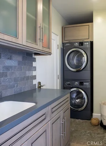 a kitchen with a sink and a stove