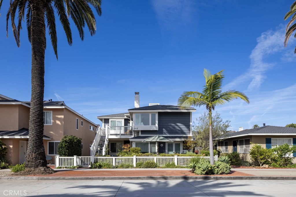 309 Marguerite Avenue, Unit C Corona del Mar, CA 92625 - Photo 15 of 15 a front view of a house with a garden and plants