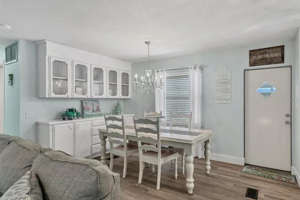 a view of a dining room with furniture and window