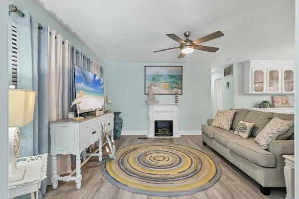 a living room with furniture and a fireplace