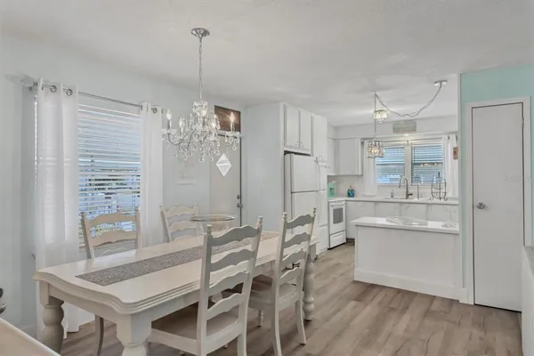 a view of a dining room with furniture and window