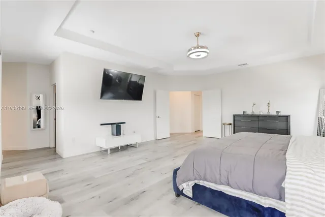 a bathroom with a sink a mirror and a shower