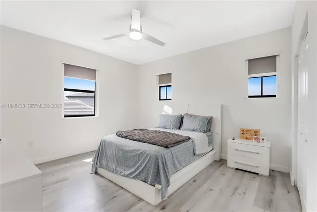 a bedroom with furniture and a chandelier