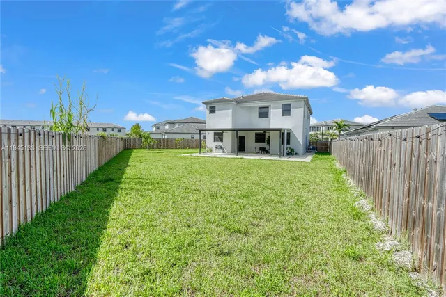 an aerial view of a swimming pool and outdoor space