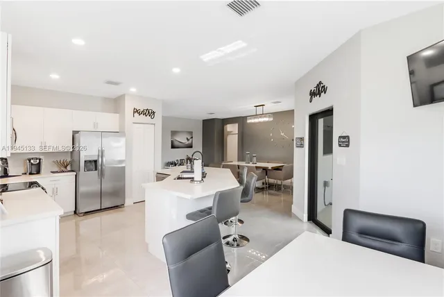 a view of a workspace with furniture and a bedroom