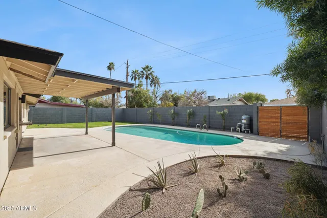 a view of a swimming pool with a garden