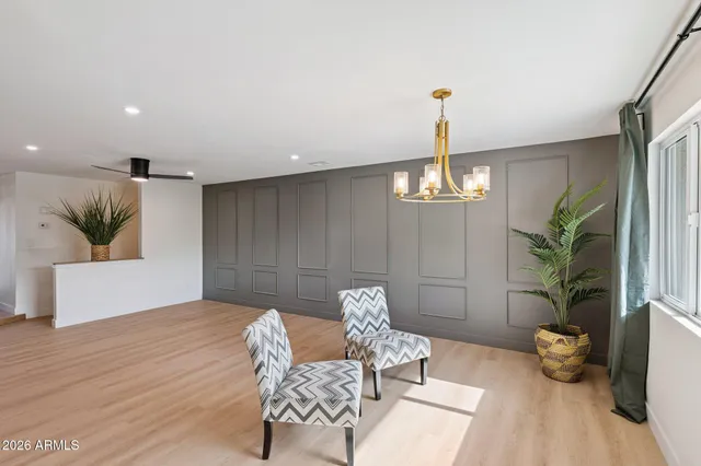 a living room with furniture and a potted plant
