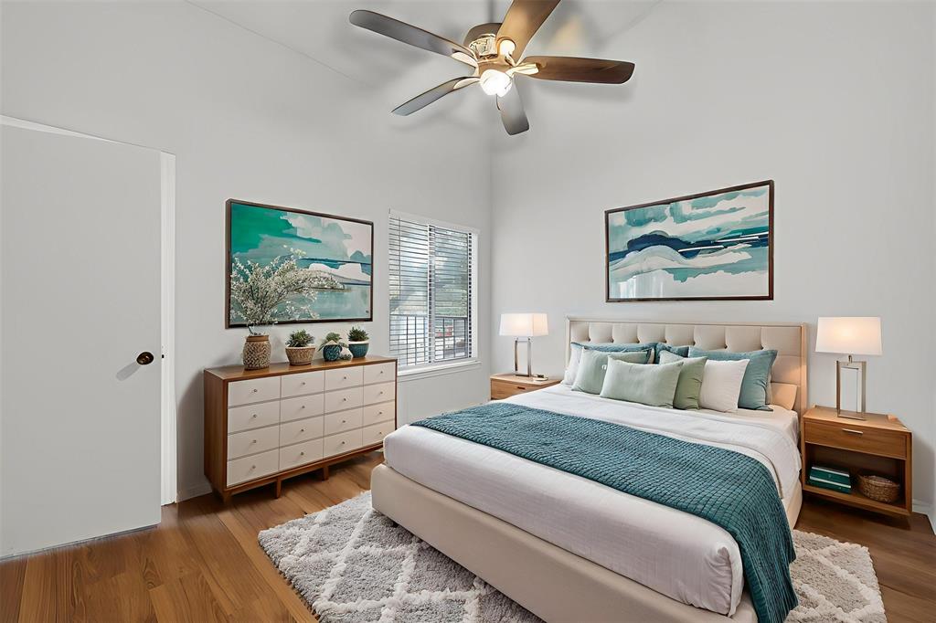 18040 Midway Road, Unit 195 Dallas, TX 75287 - Photo 11 of 17 a bedroom with a bed and a painting on the wall