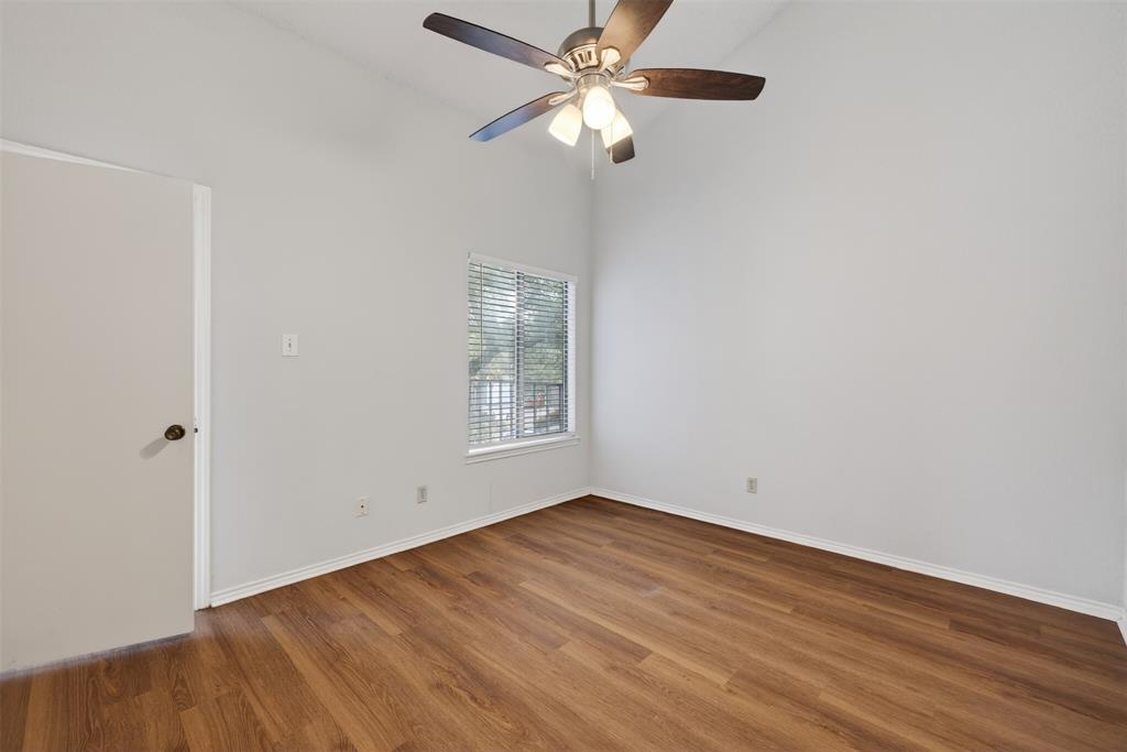 18040 Midway Road, Unit 195 Dallas, TX 75287 - Photo 12 of 17 an empty room with a window and a fan