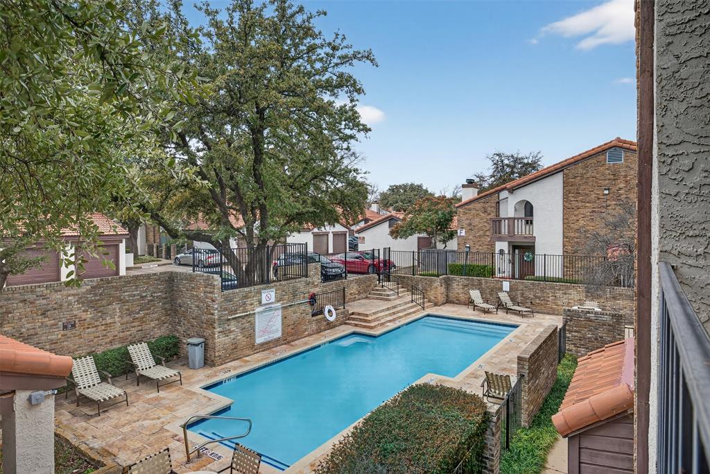 18040 Midway Road, Unit 195 Dallas, TX 75287 - Photo 17 of 17 a view of a house with pool and chairs