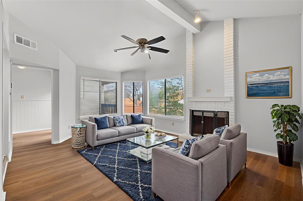 18040 Midway Road, Unit 195 Dallas, TX 75287 - Photo 3 of 17 a living room with furniture and a fireplace