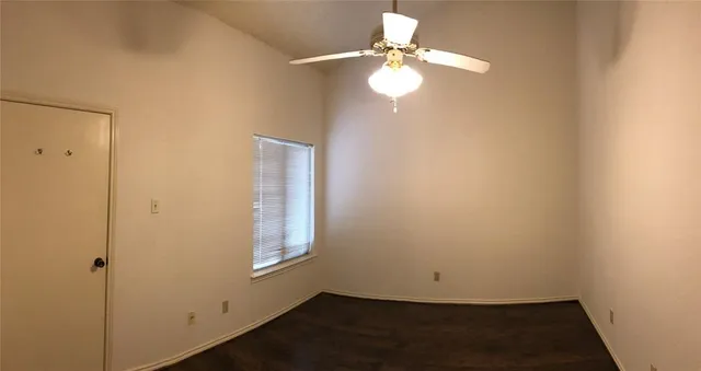 en empty room with wooden floor